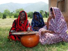 Mukancwanga from Busongora, near Lake George in western Uganda plays harp with her beautiful daughters-in-law.  She is an international award-winning harpist, invited by UNESCO to perform in Paris.